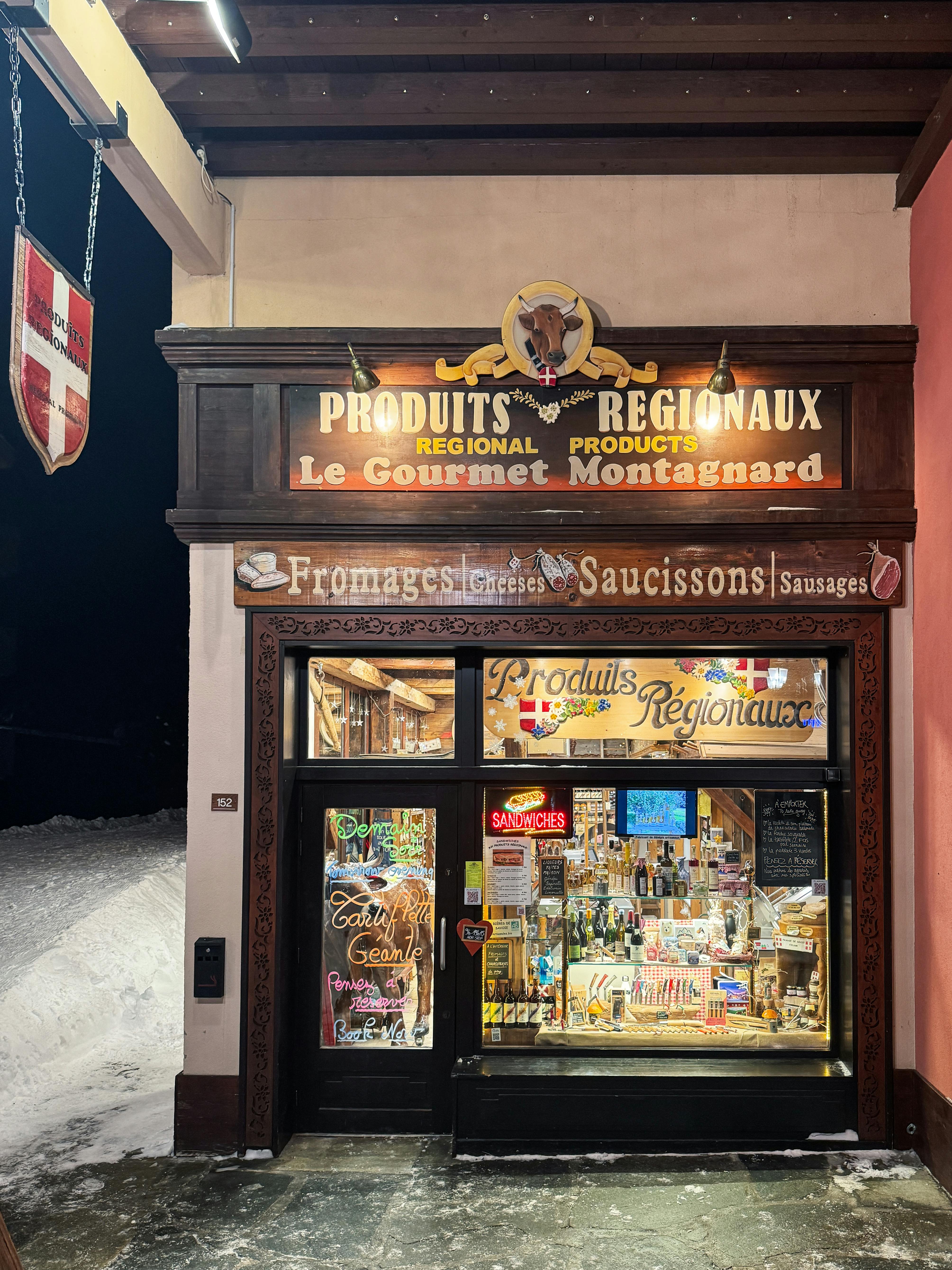 Traditional Savoyard delicatessen selling regional cheeses and cured meats in Les Arcs village, French Alps